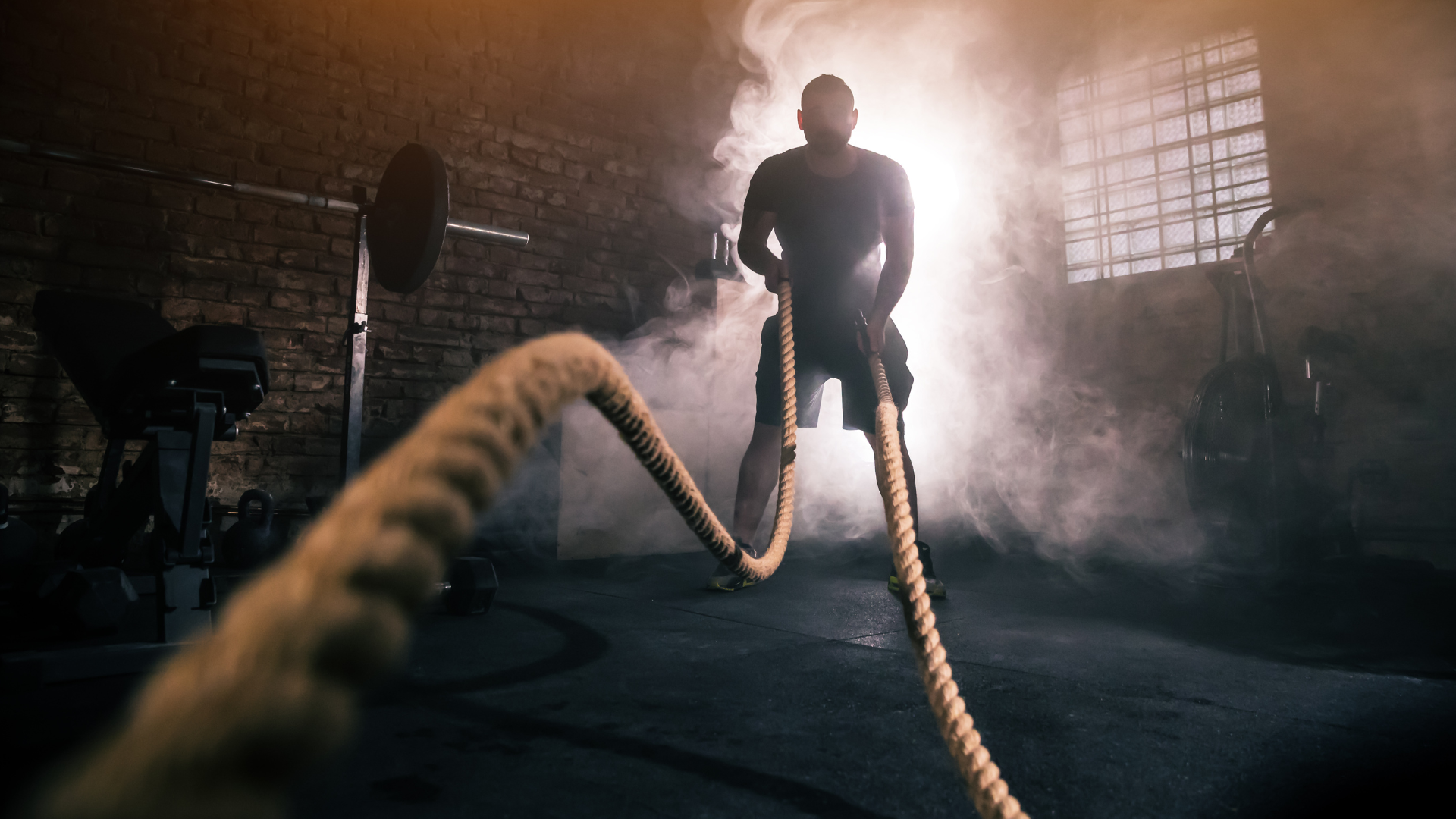 Men exercising with rope