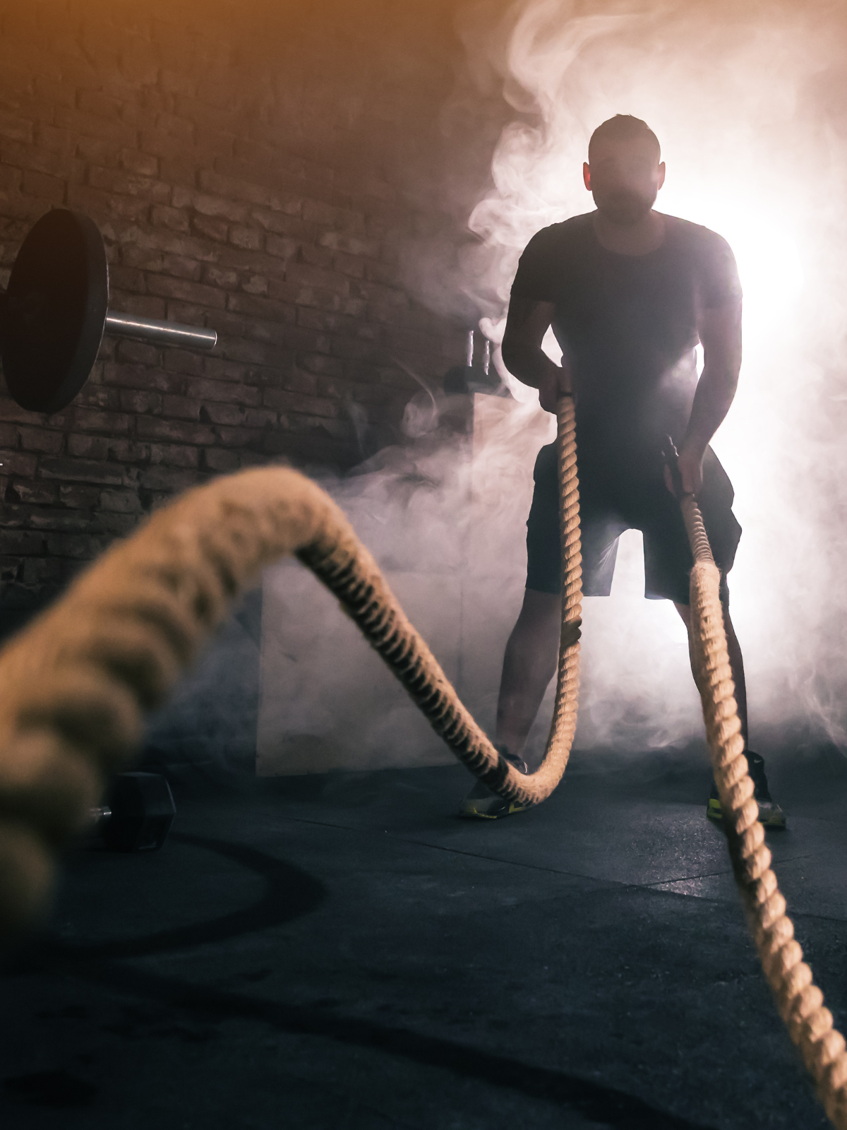 Men exercising with rope