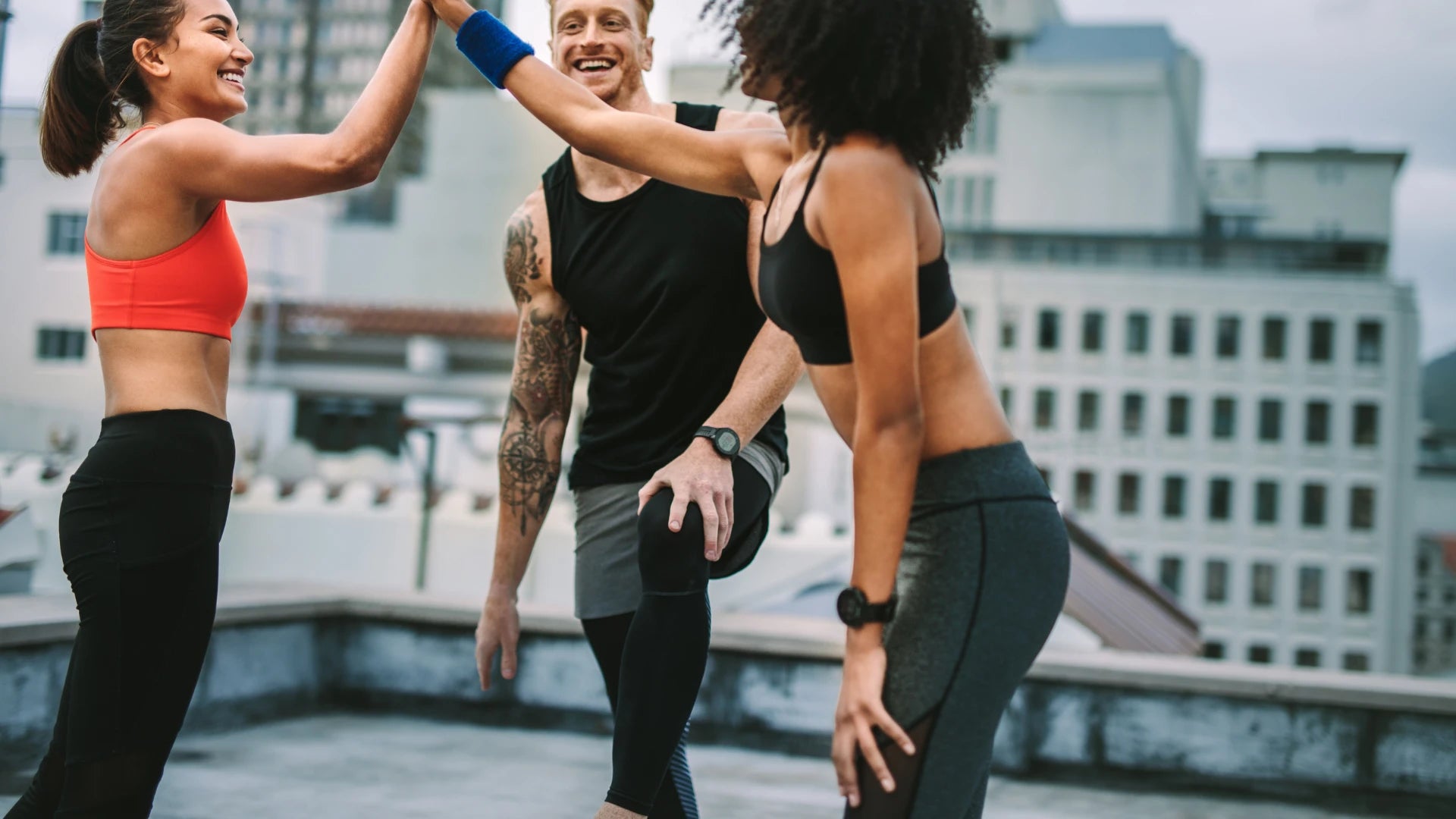 Two females and male Group discussing fitness strategy