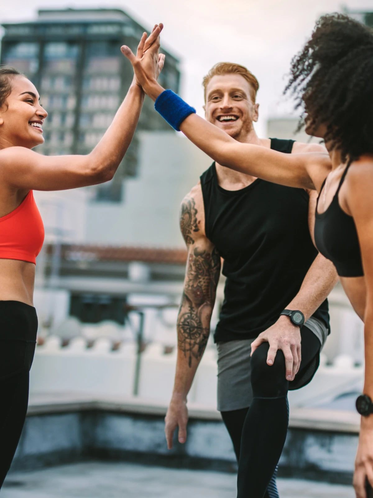 Two females and male Group discussing fitness strategy