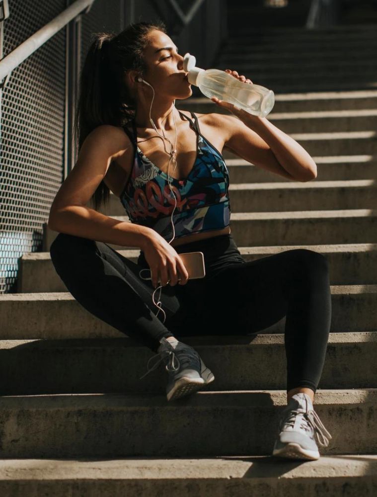 Girl drinking water from bottle